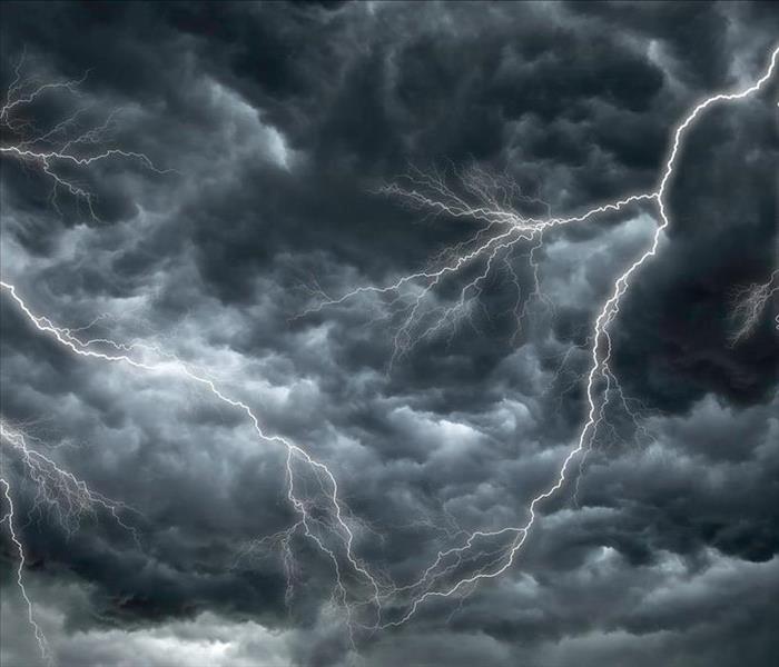 Image of a sky with stormy dark clouds and thunders