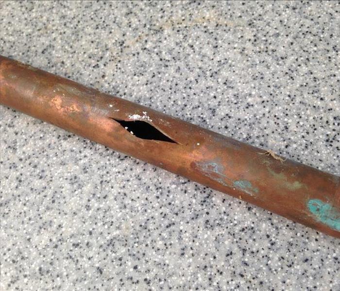 Broken pipe with a hole. 