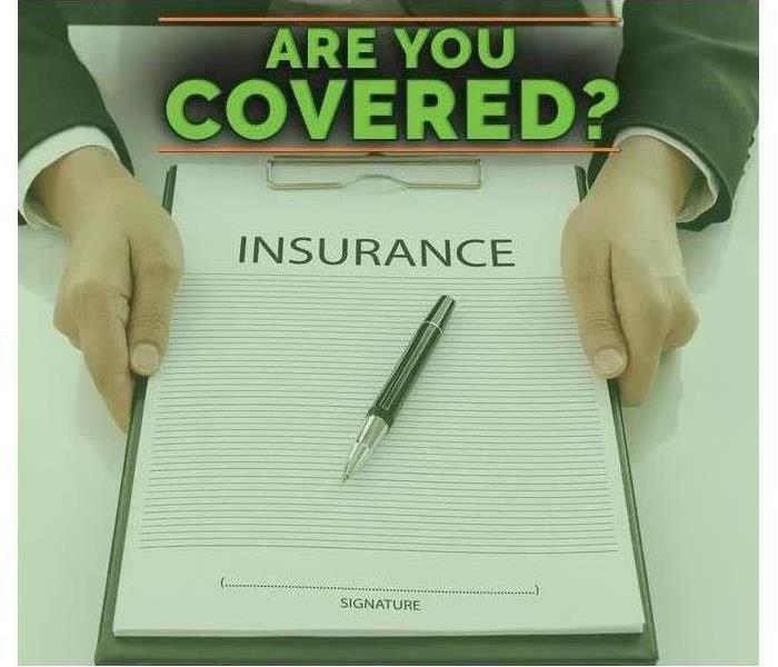 Image of a person holding an insurance claim. 