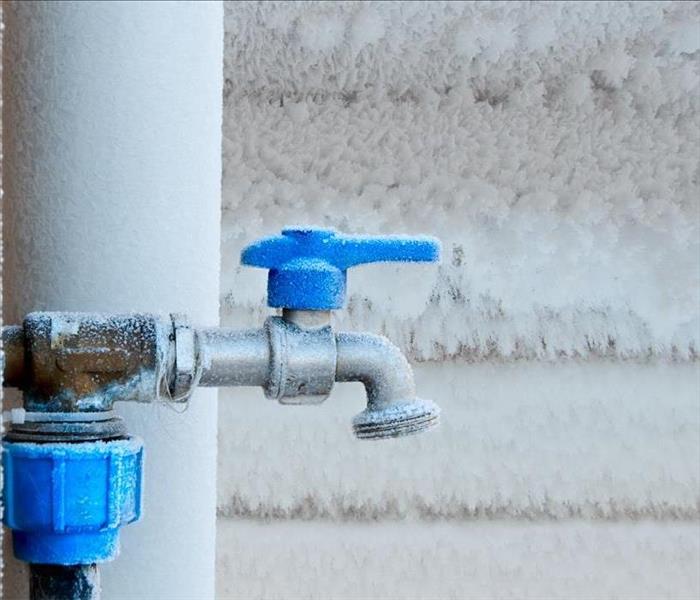 Image of frozen pipe and faucet.